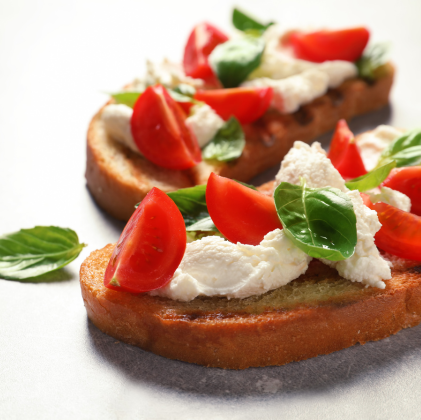 Tomato and red onion and balsamic glaze crostini